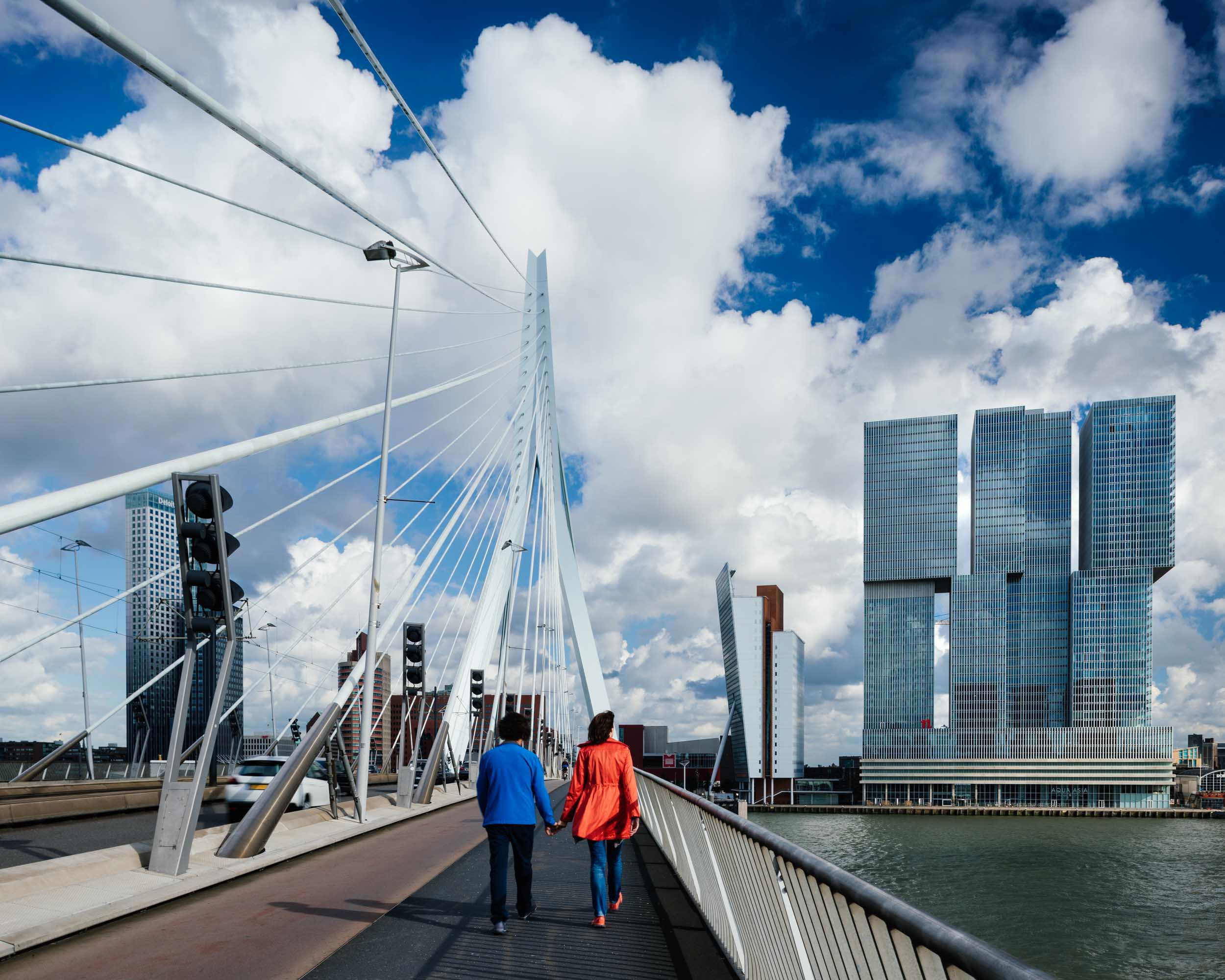 couple-walking-erasmus-bridge-rotterdam-netherlands-holland-travel