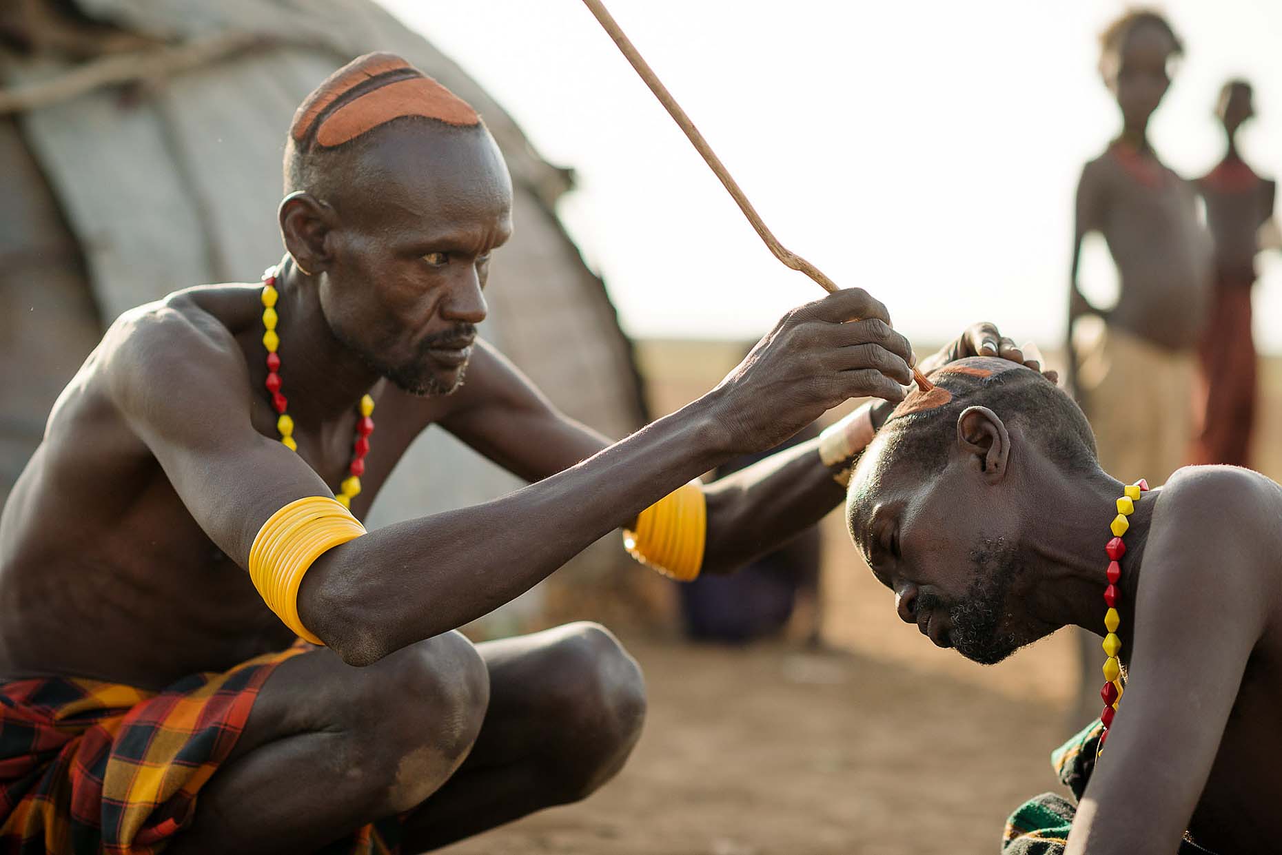 men-applying-clay-hair-decoration-traditional-dassenech-tribe-omorate-omo-valley-ethiopia-africa-15