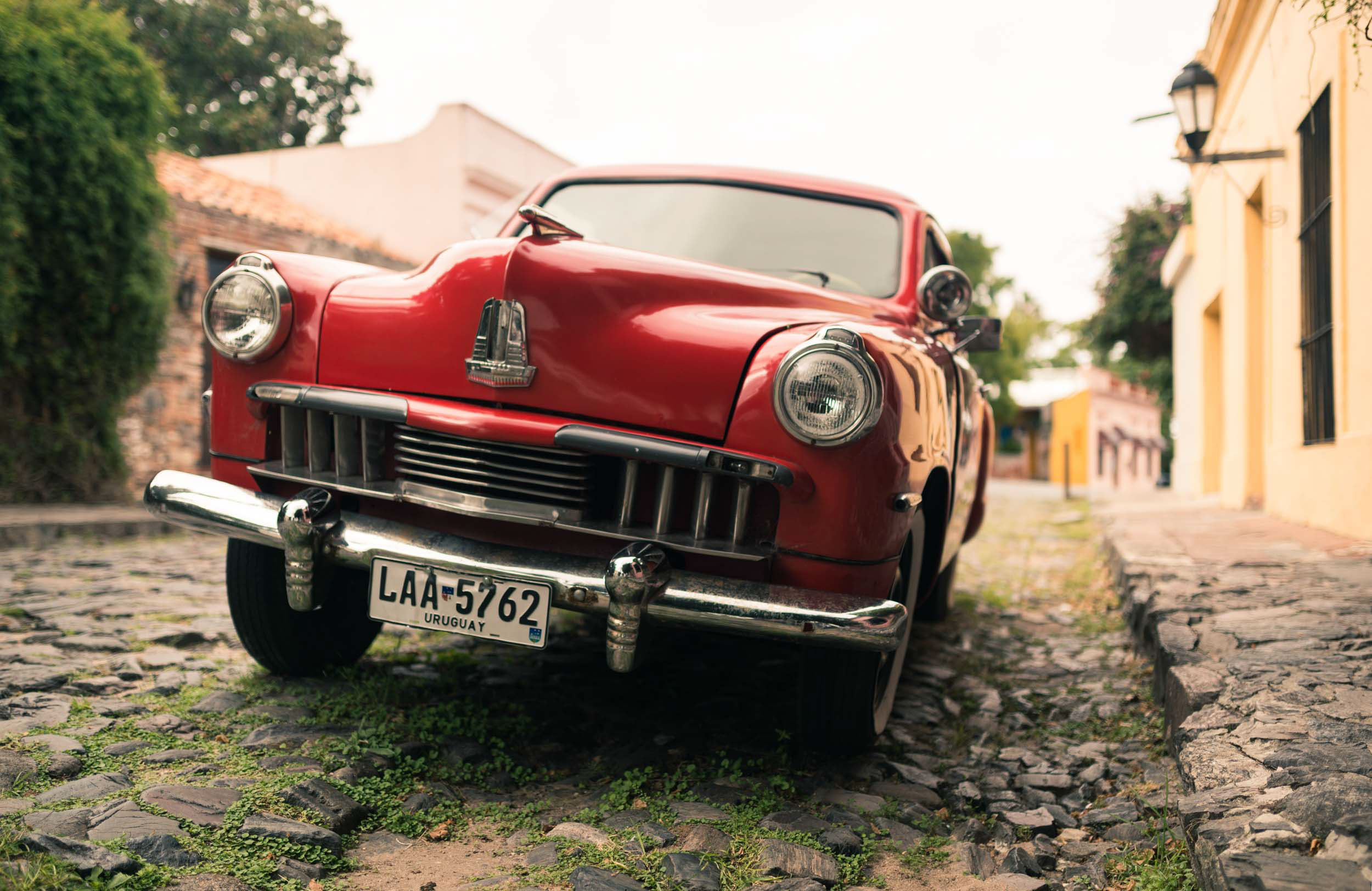 vintage-red-car-vehicle-cobbled-street-colonia-del-sacramento-uruguay-latin-america