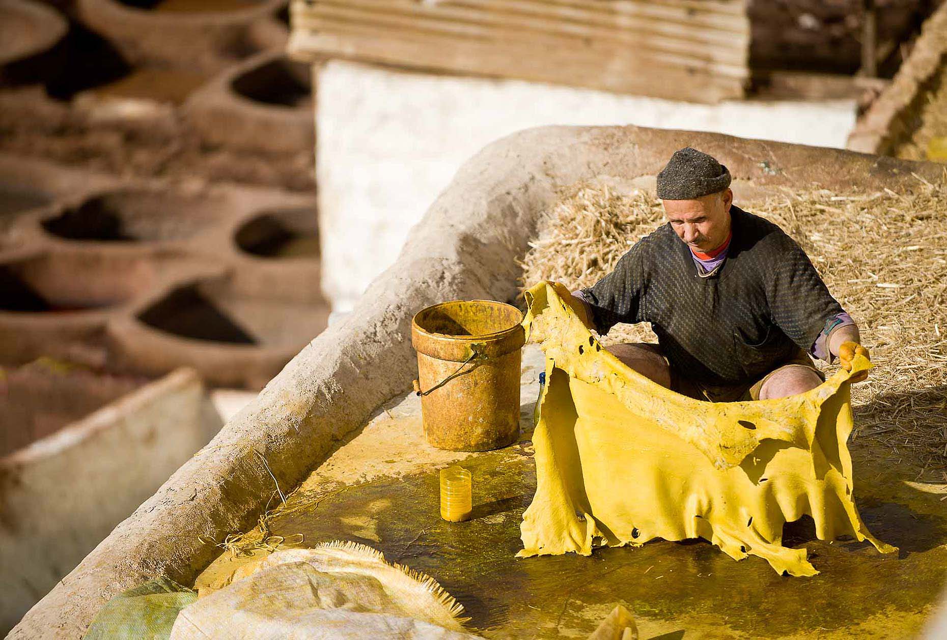 worker-leather-tanneries-fes-morocco-travel-06
